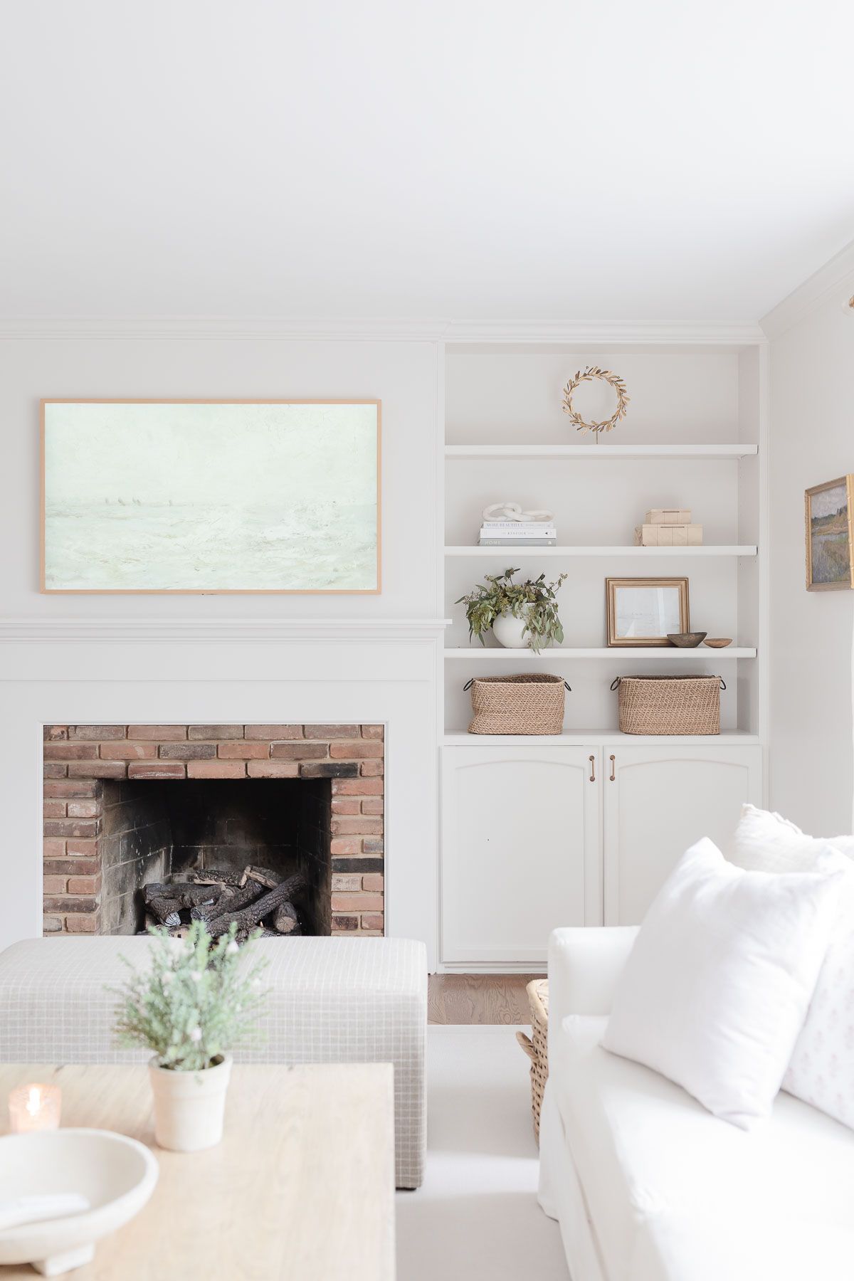 A white living room with a white Pottery Barn sofa