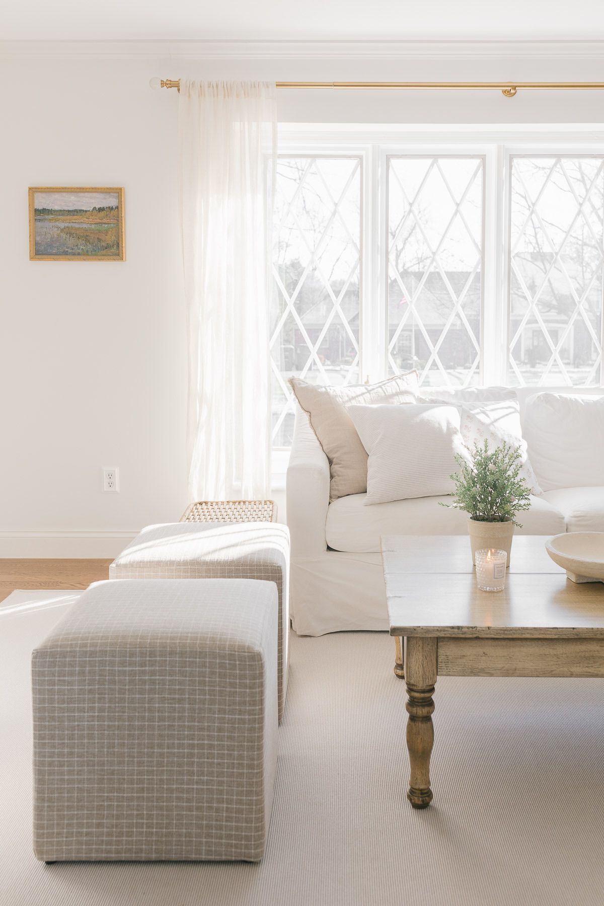 A white living room with a white Pottery Barn sofa