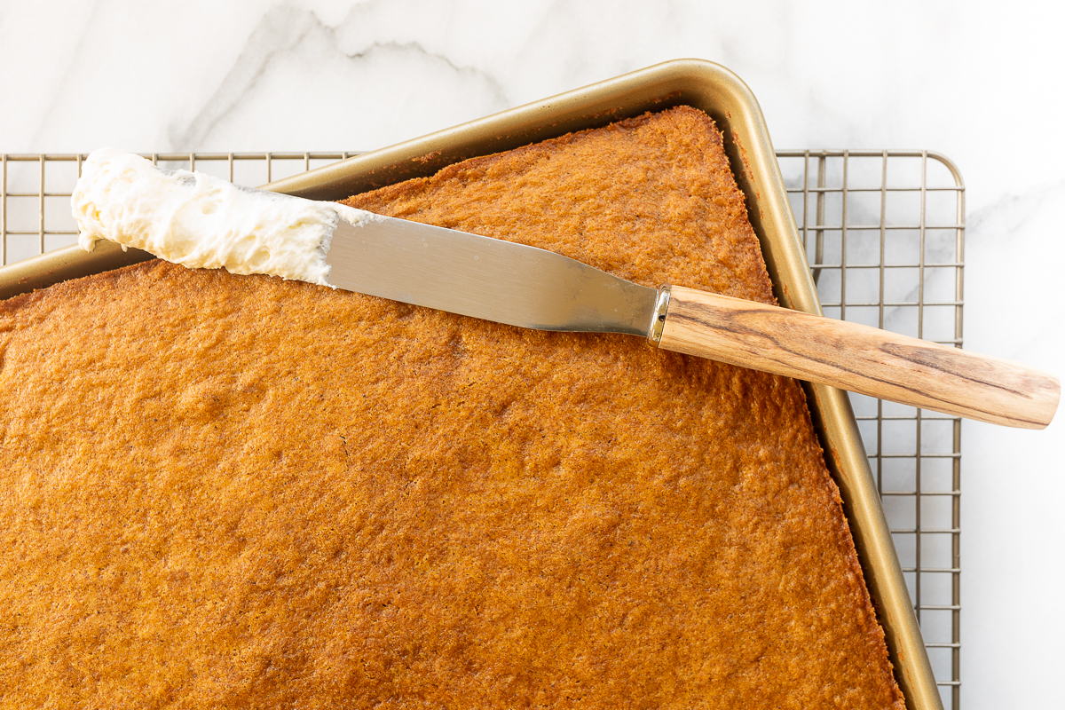 A gold pan filled with freshly baked pumpkin bars.