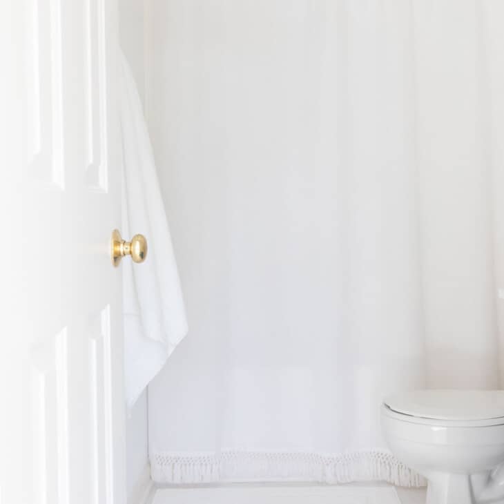 white bathroom with white tile