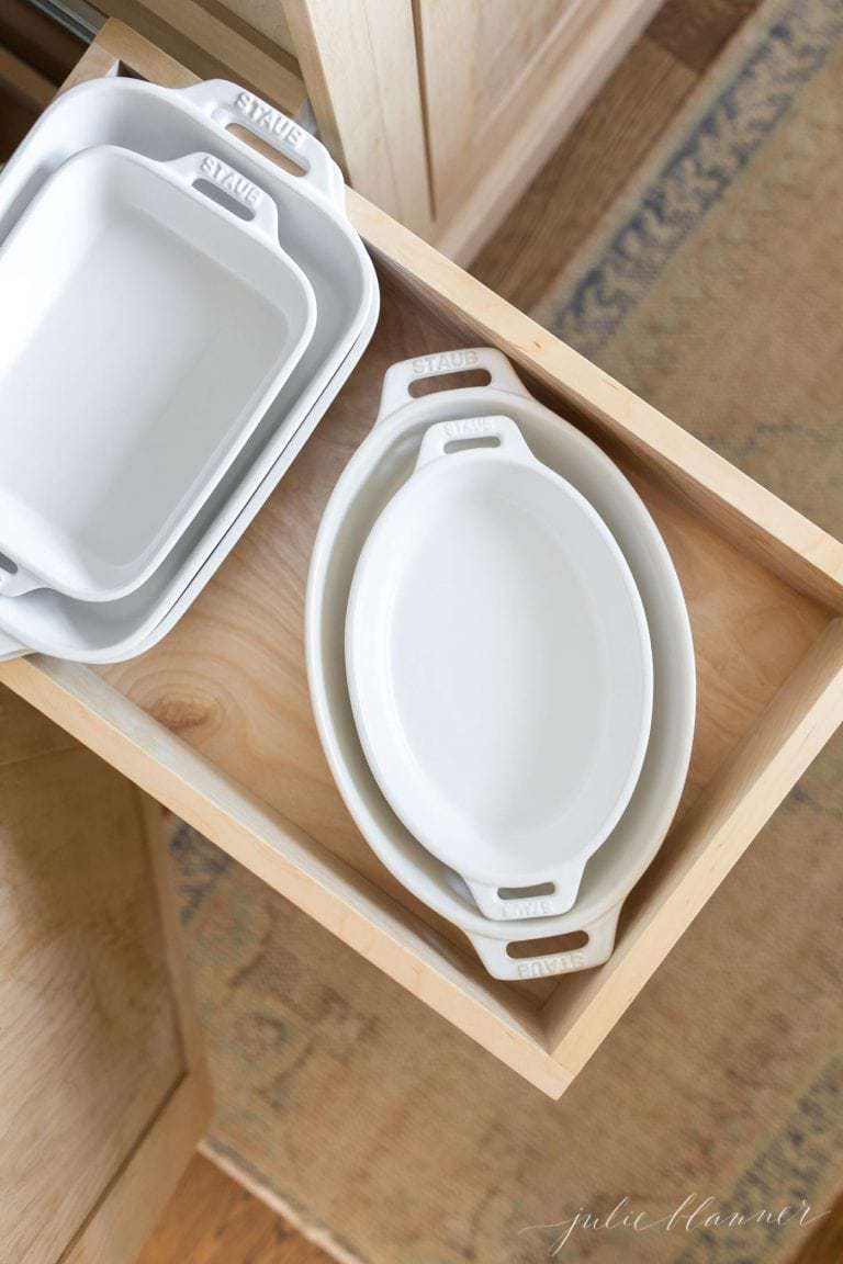 Inside a kitchen drawer, white Staub baking dishes make the best gifts for bakers.