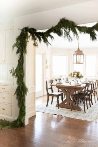 Blue Christmas Table Setting with Easy Juniper and Rose Centerpiece