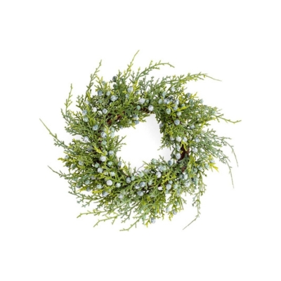 A holiday wreath made of greenery and berries.