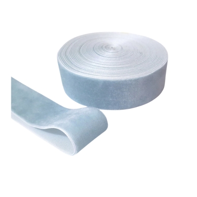 A roll of blue tape on a white surface.