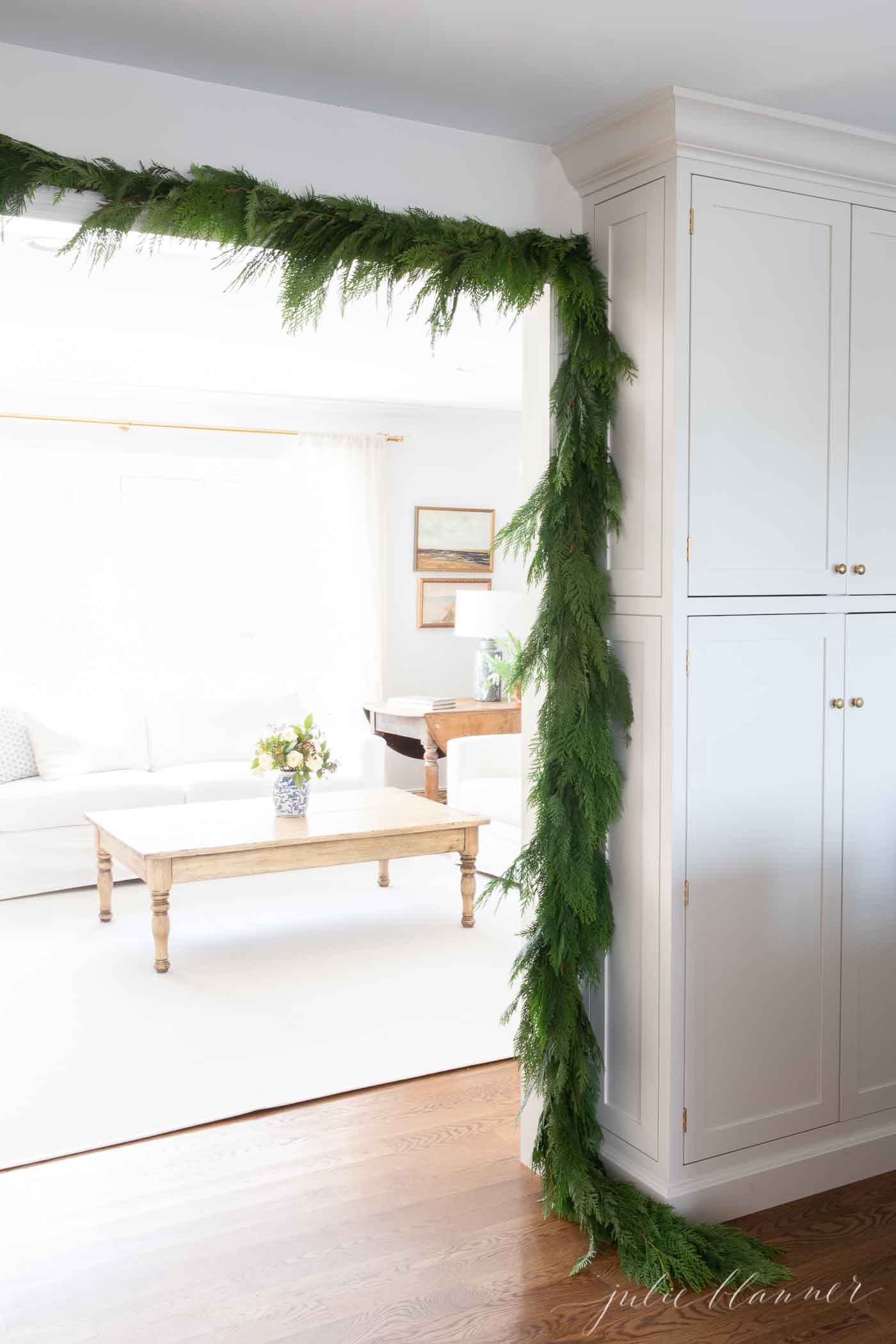 cedar garland over door frame looking into living room
