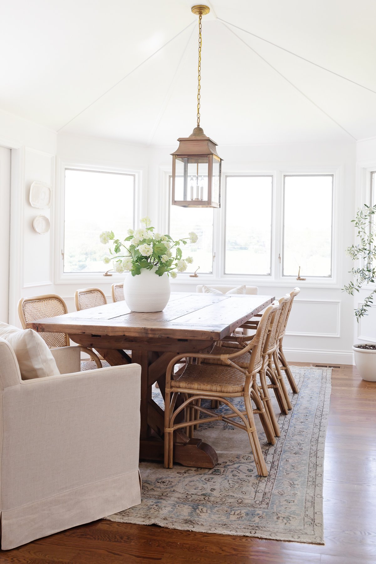 Hosting Thanksgiving in a traditional dining room with a wooden table and chairs.