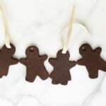 Marble surface, four gingerbread cinnamon ornaments.