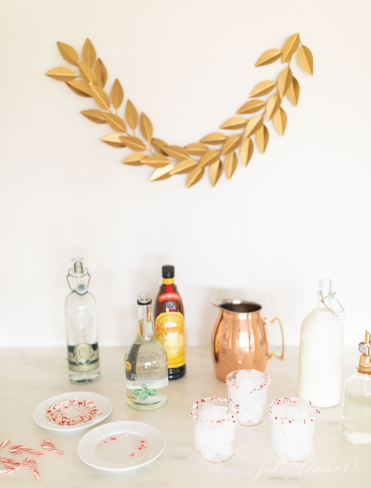 A bar set up for the holidays with ingredients for a Peppermint White Russian Cocktail.