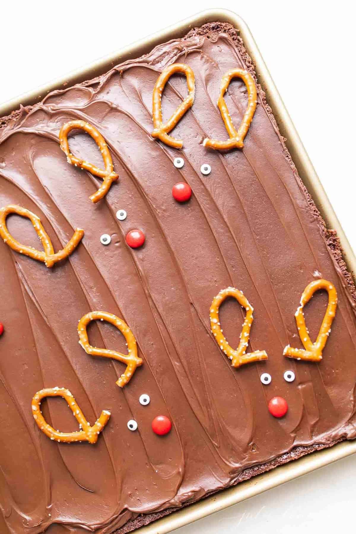 A pan of holiday brownies decorated with reindeer.