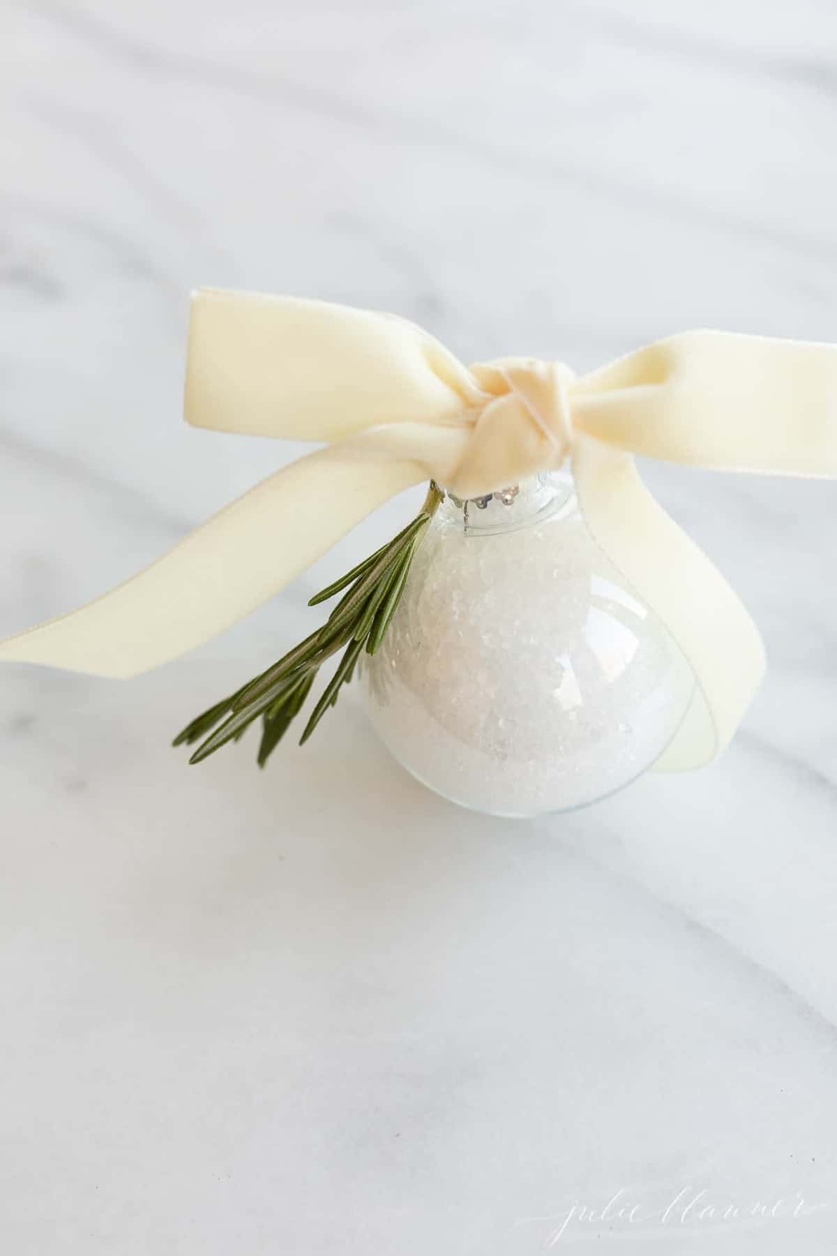 bath soak in an ornament tied with a ribbon