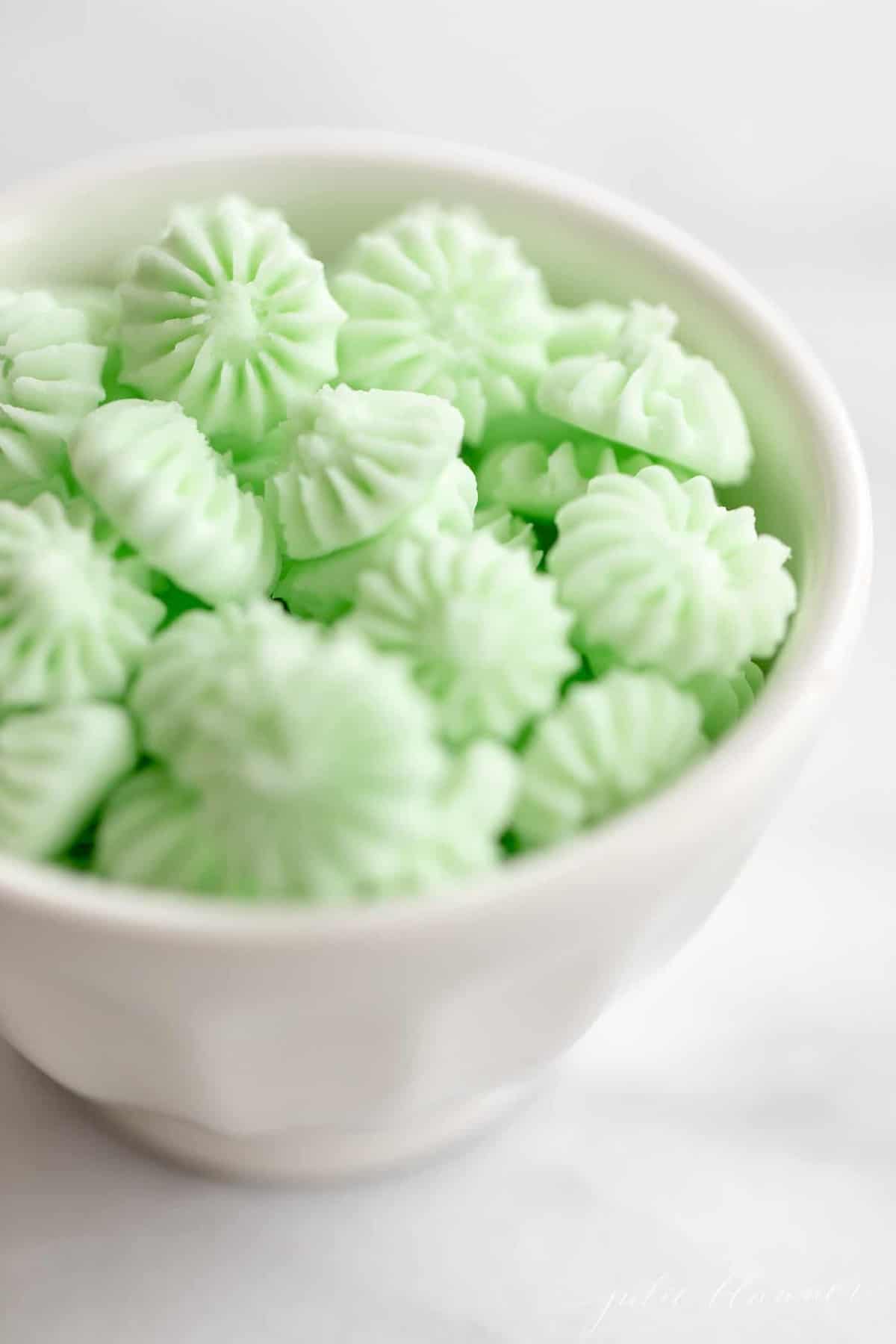 A bowl of green candies