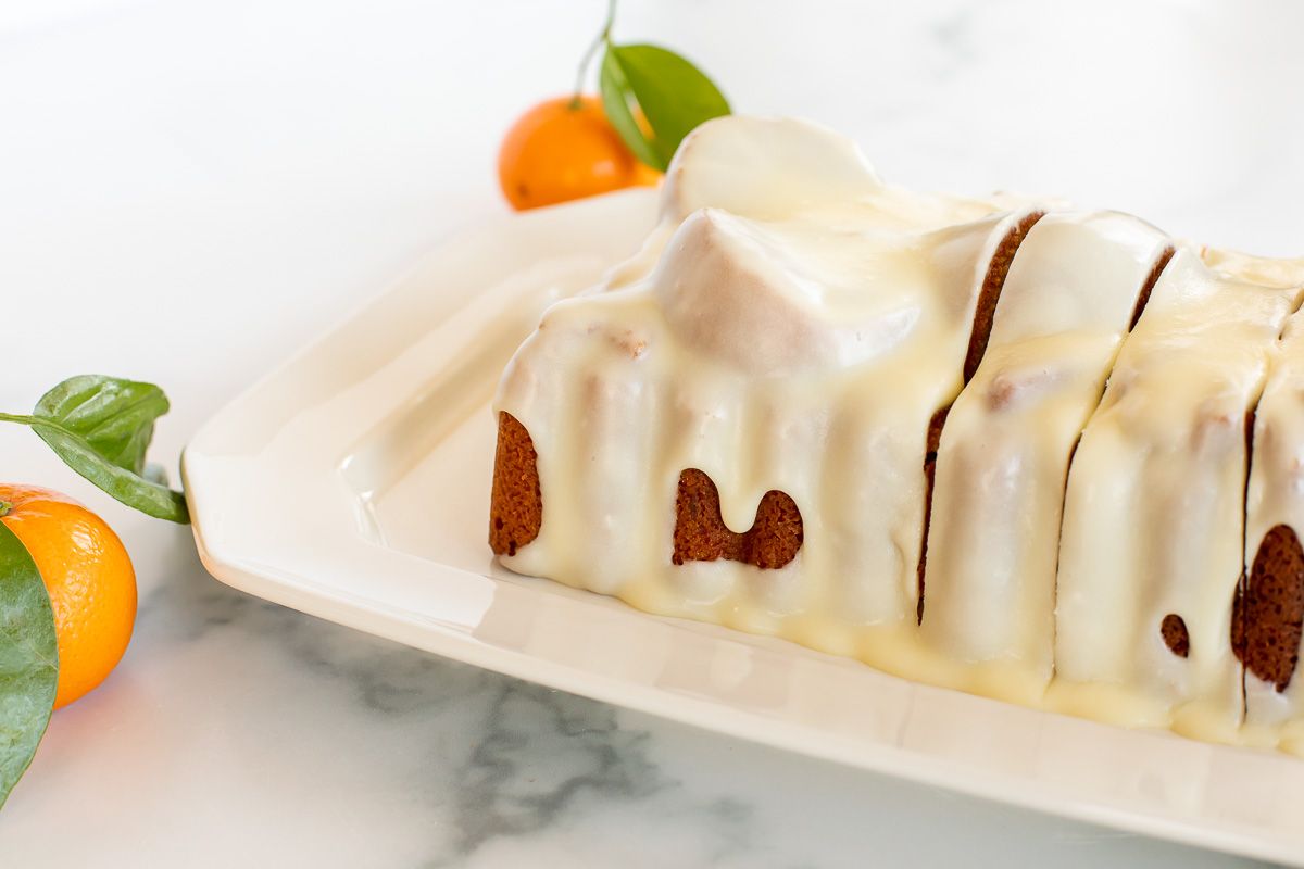 An orange pound cake covered in an orange glaze recipe.