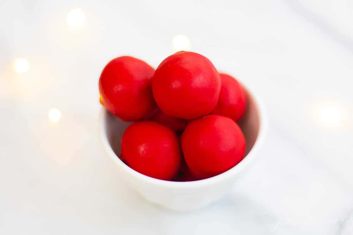 bowl of red rudolph nose no bake cookie dough truffles