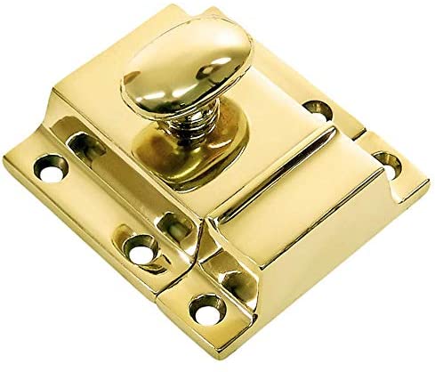 An unlacquered brass cabinet latch