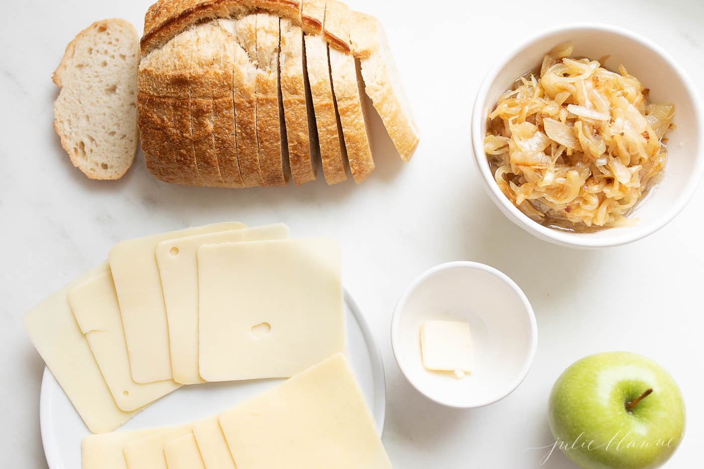 Ingredients for a gourmet apple grilled cheese.