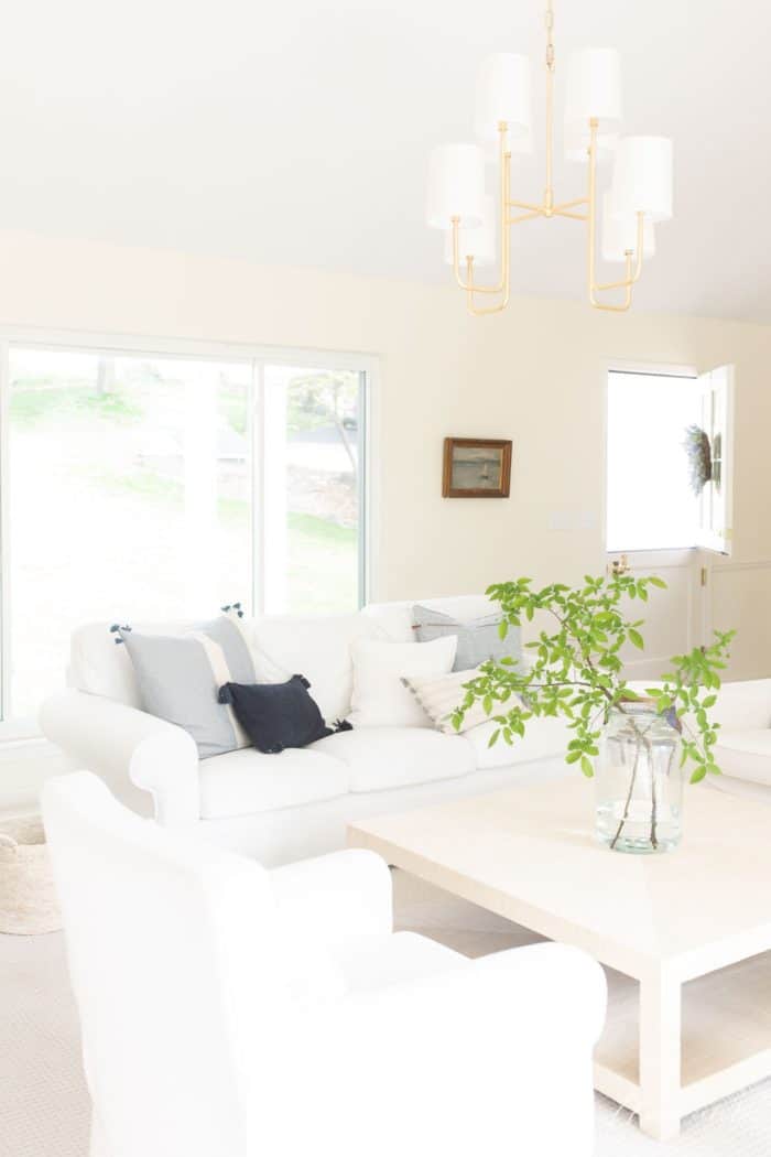 Simple living in a white living room filled with sunlight.