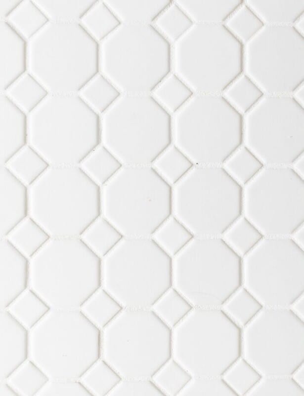 White hexagon tile floor, white grout.