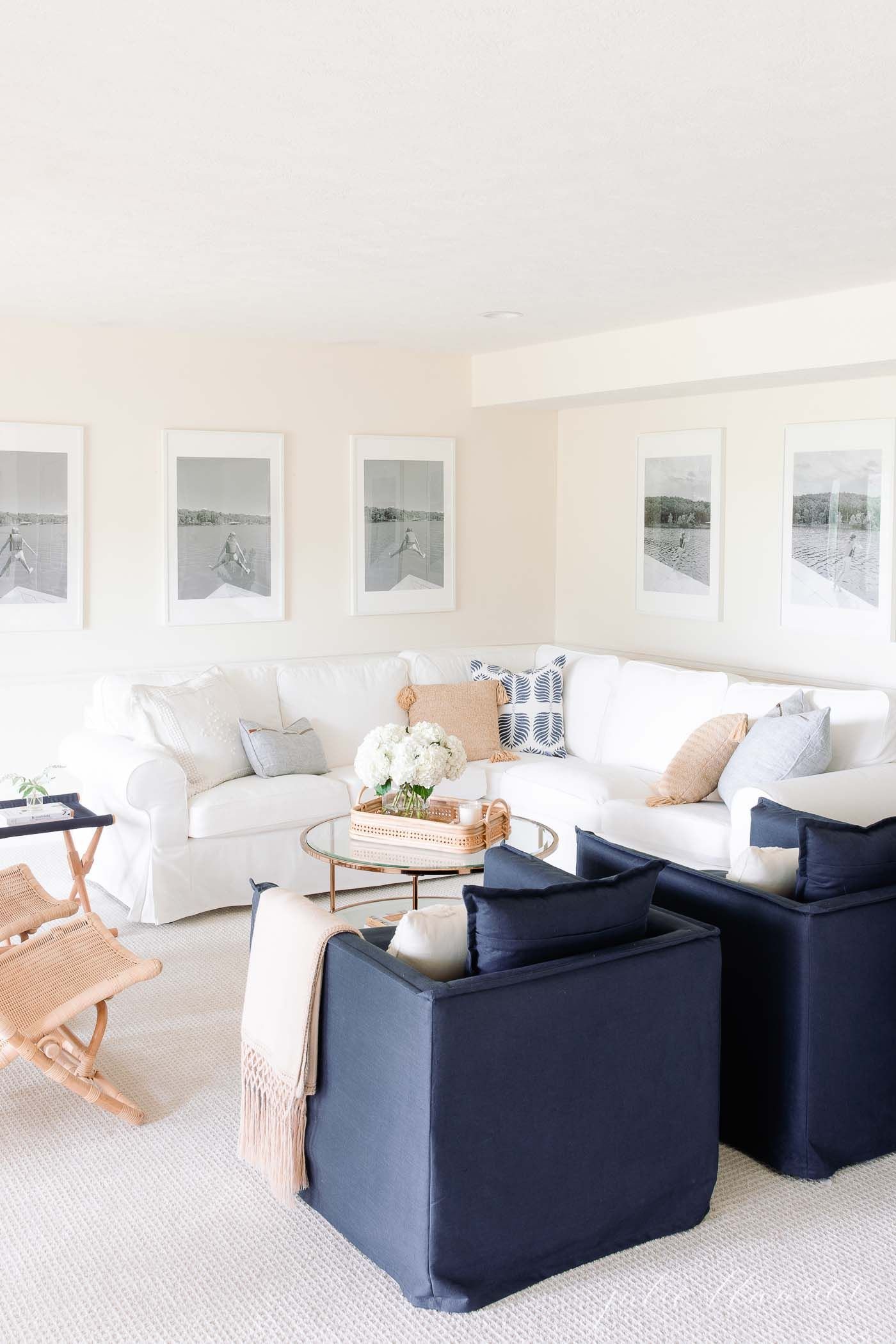 A white living room with blue and white pillow covers