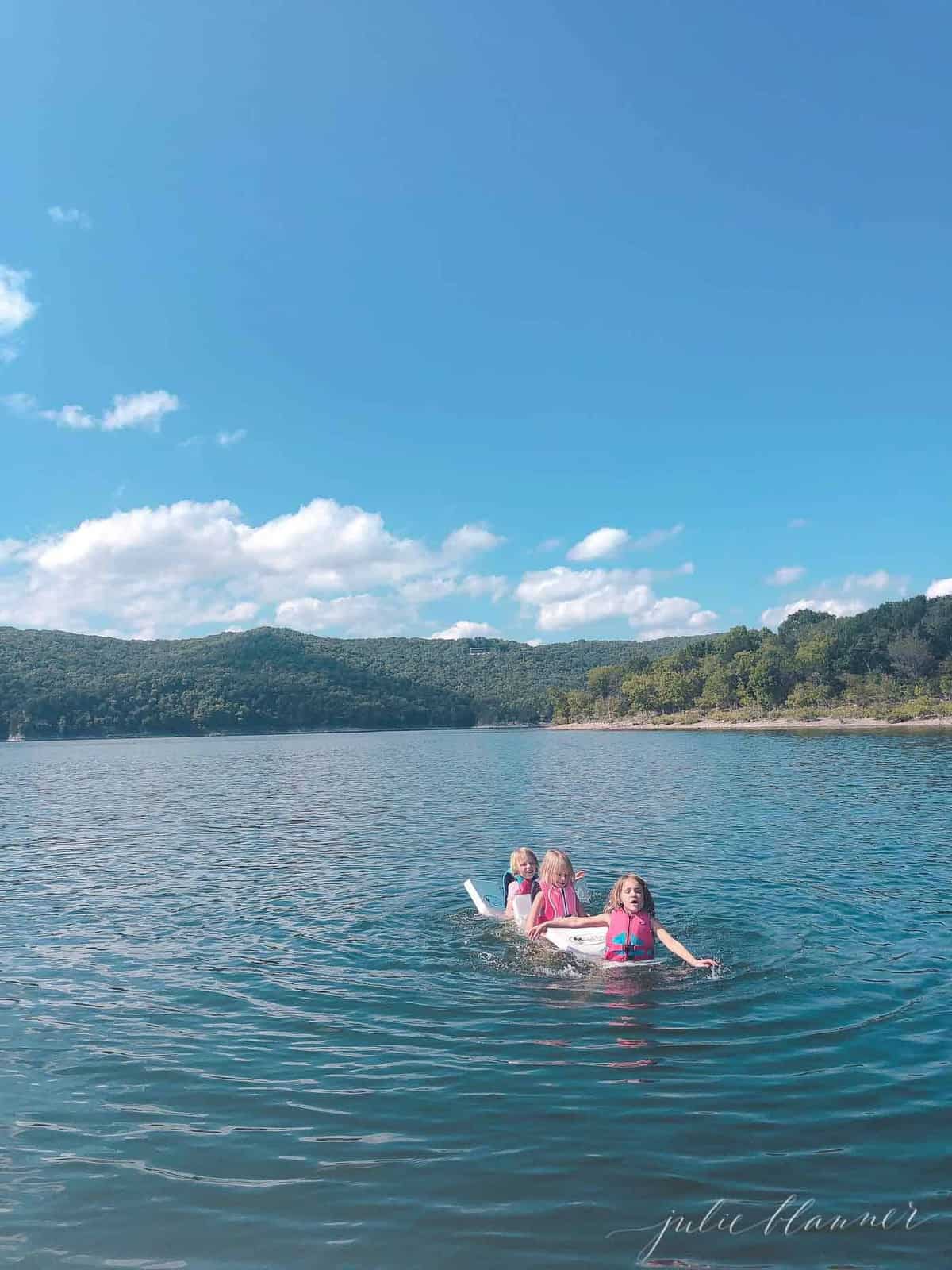 3 girls swimming in table rock lake