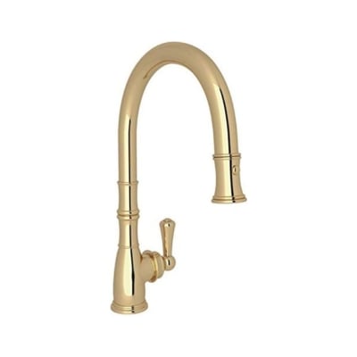 An unlacquered brass kitchen faucet against a white background.