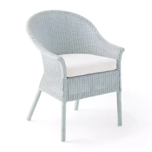 A light blue wicker chair with a white cushion, featuring a curved back and armrests.