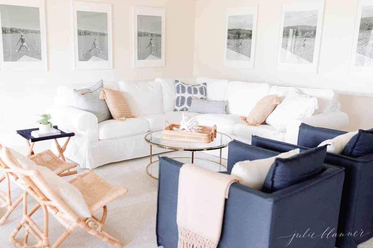 Low Back White Sofa with Blue Pillows and Throw - Transitional - Living Room