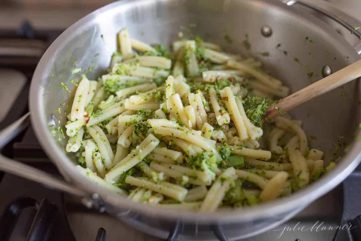 a silver pot filled with homemade broccoli pasta