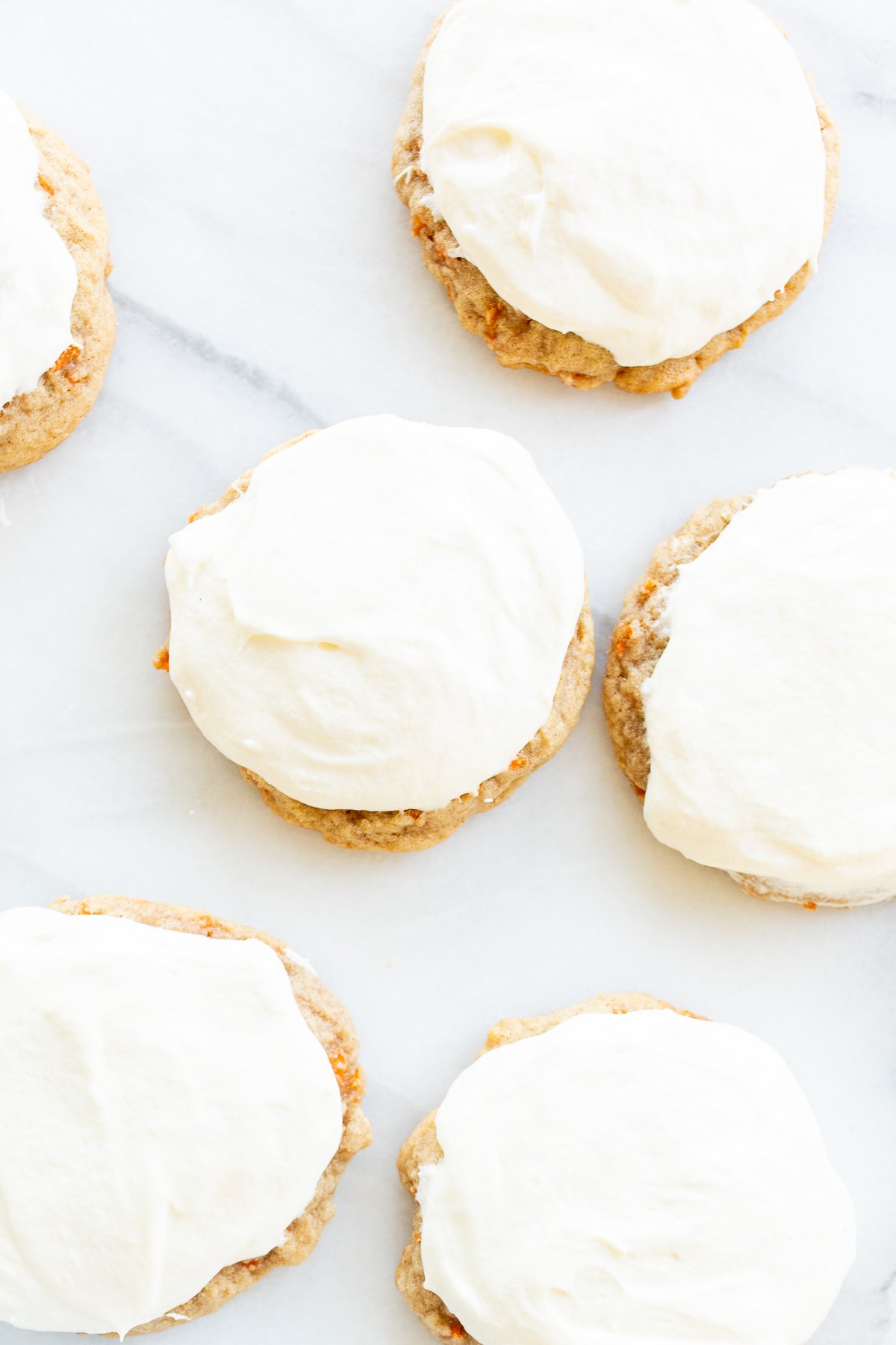 Carrot cake cookies topped with cream cheese frosting. 