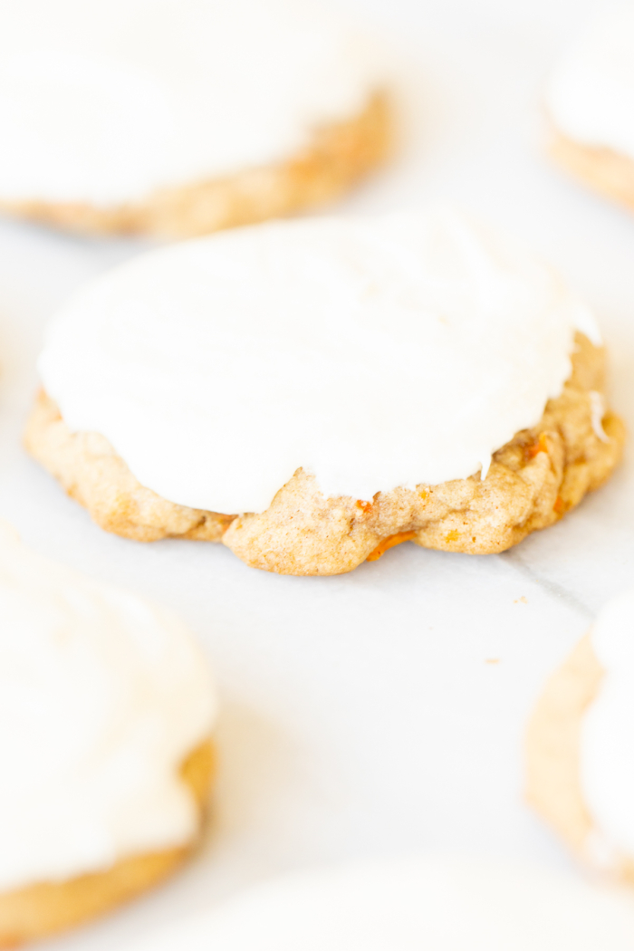 Carrot cake cookies topped with cream cheese frosting.