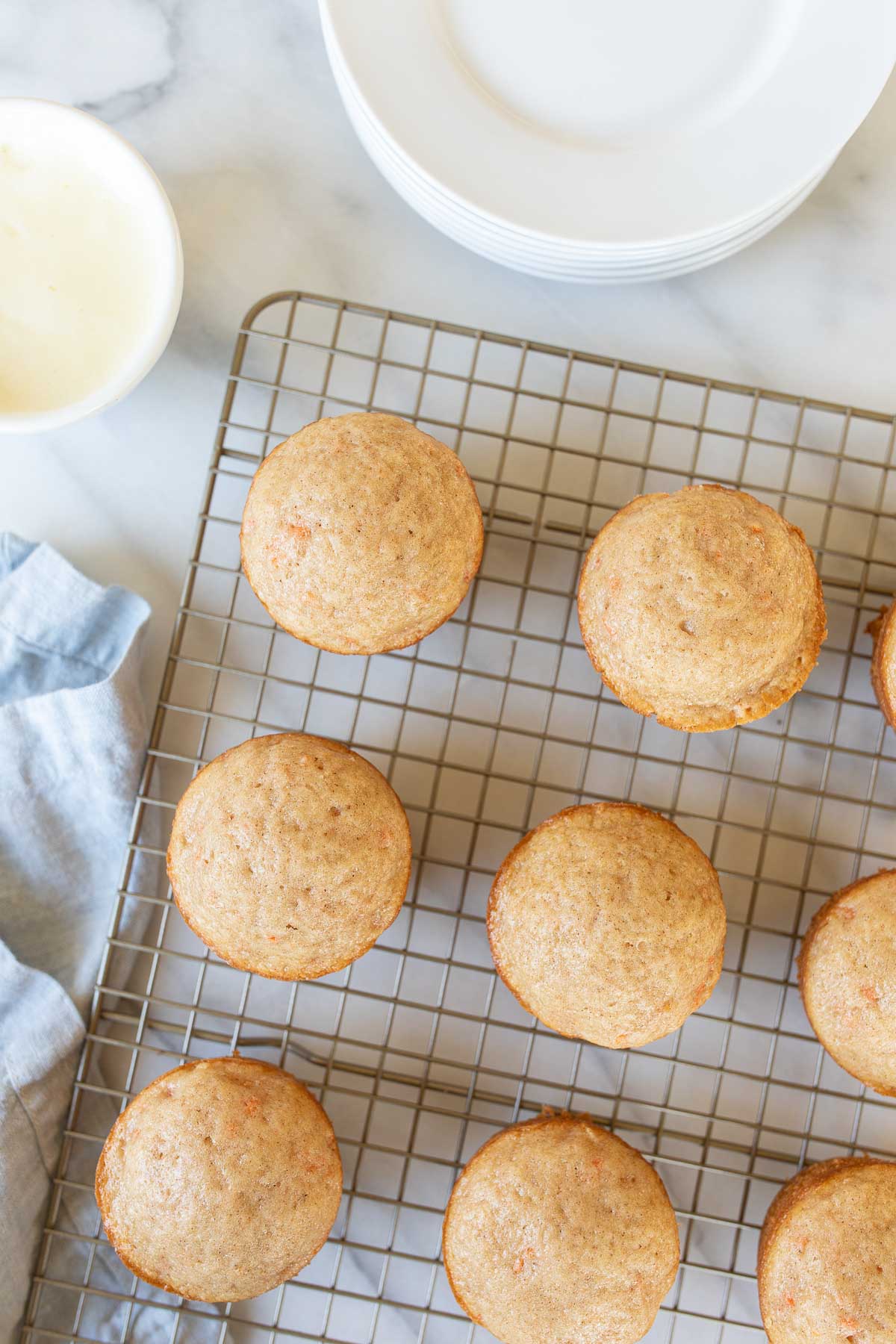Carrot Cake Muffins on a cooling rack.