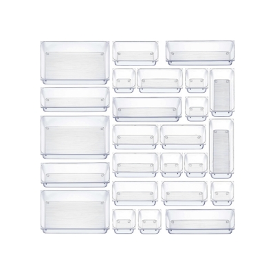 A group of kitchen drawer inserts made of clear plastic containers on a white background.