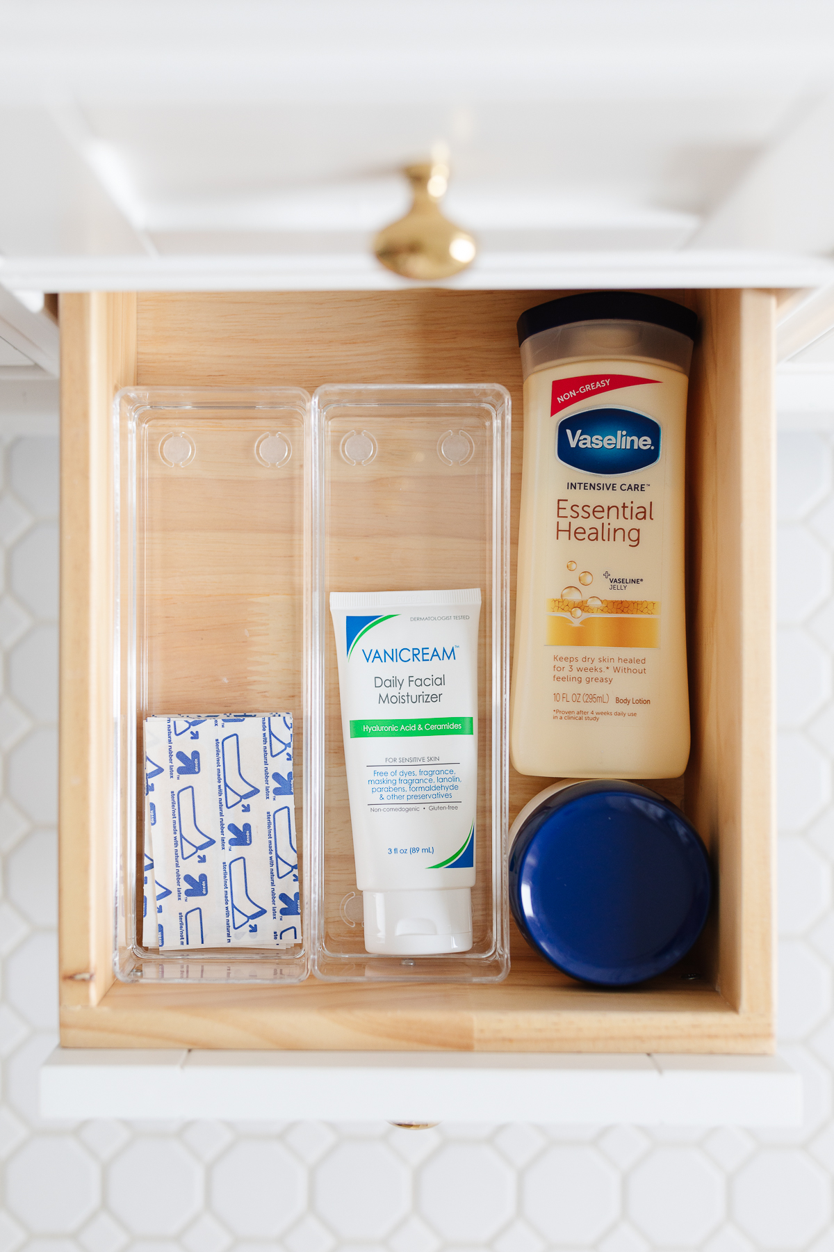 A bathroom drawer with a convenient drawer organizer for toiletries.