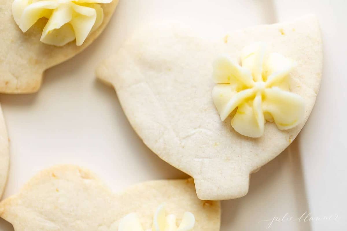 Close up of cute lemon cookies cut out as ducks for Easter