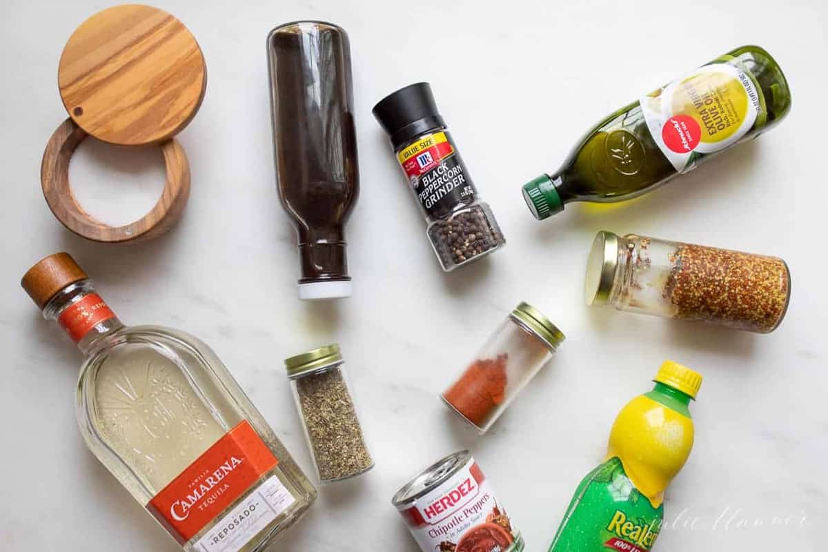 Marble surface with ingredients for a mexican marinade laying out.