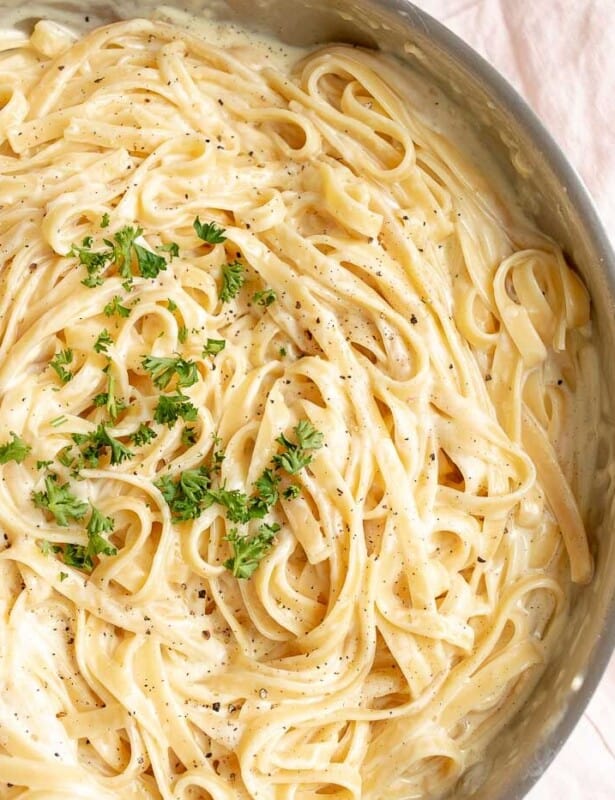 Fettuccine Alfredo in a metal pan.