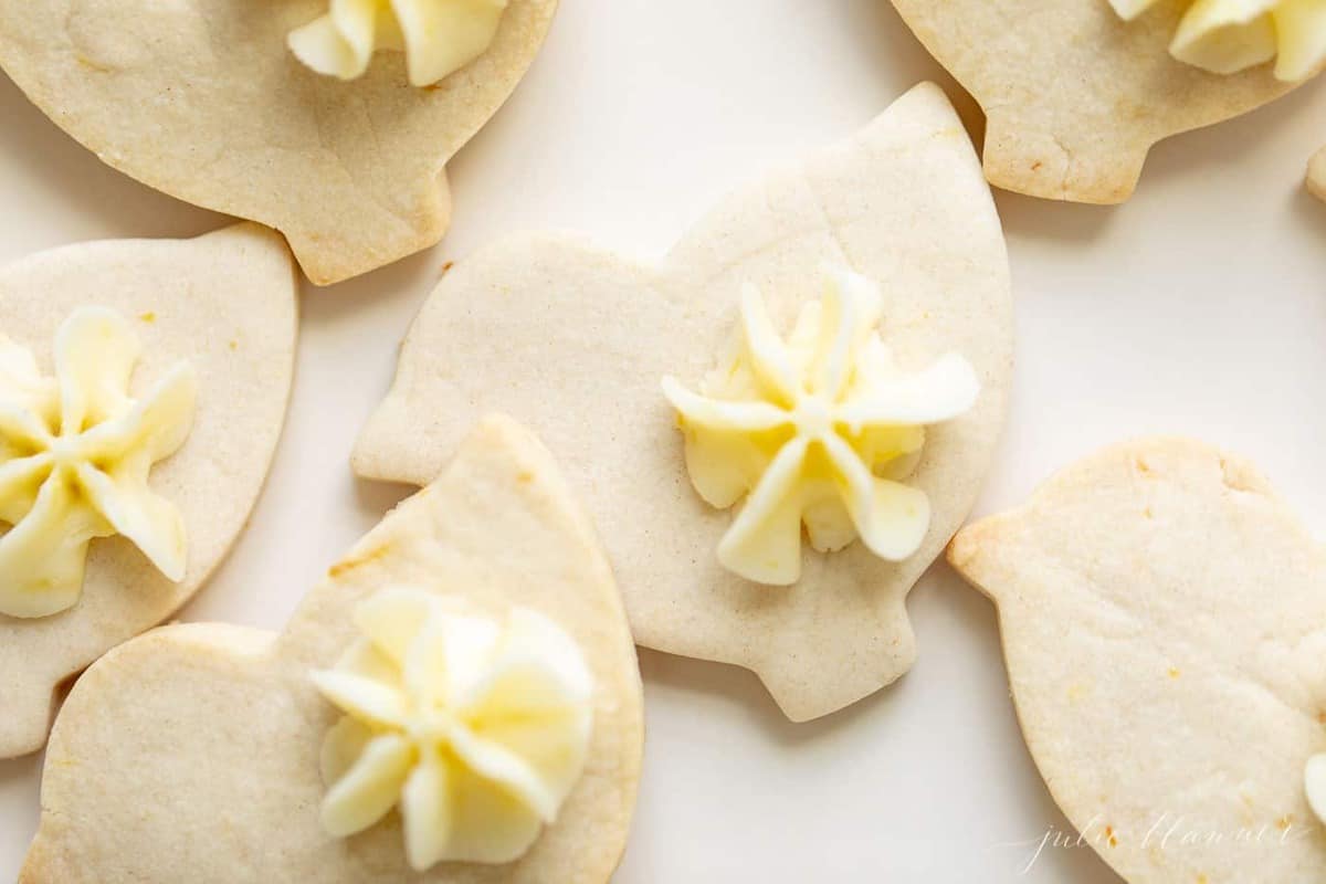 Close up of cute lemon cookies cut out as ducks for Easter