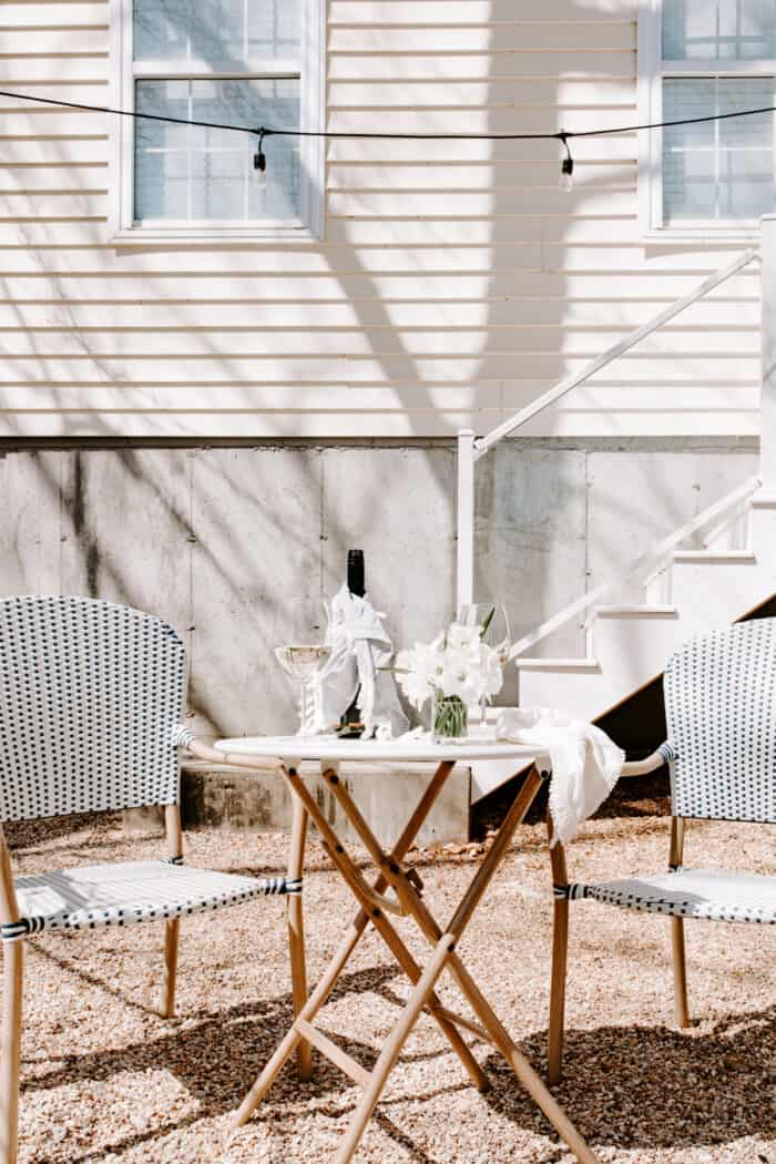 bistro set under string lights