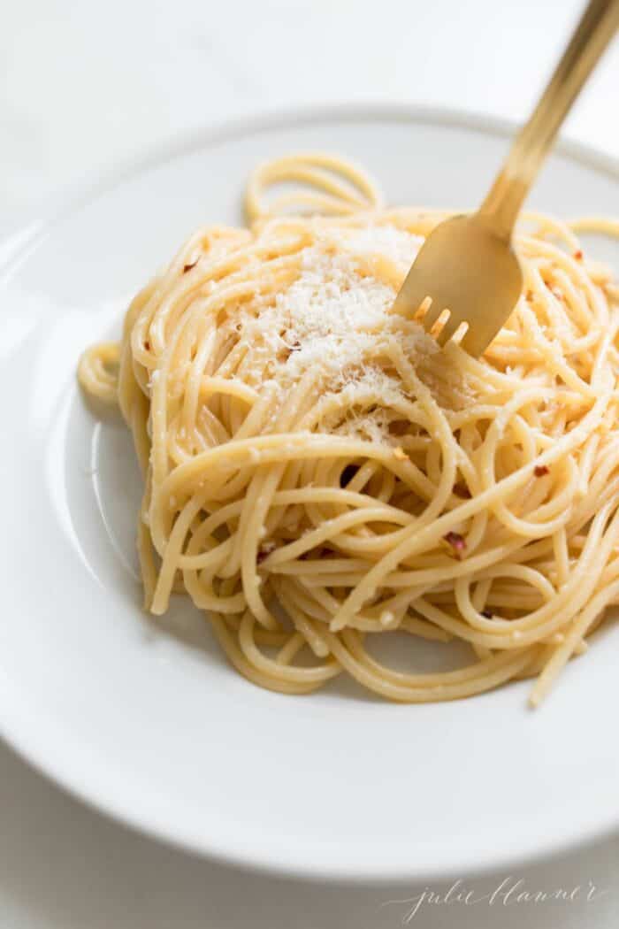 A bowl of pasta with a simple sauce made from pantry ingredients.