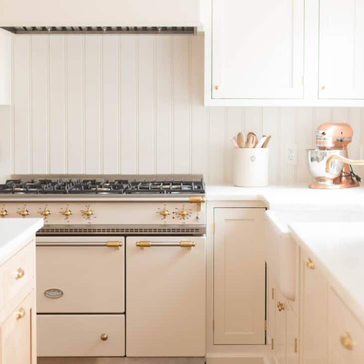 A cream cabinet with an apron front sink.