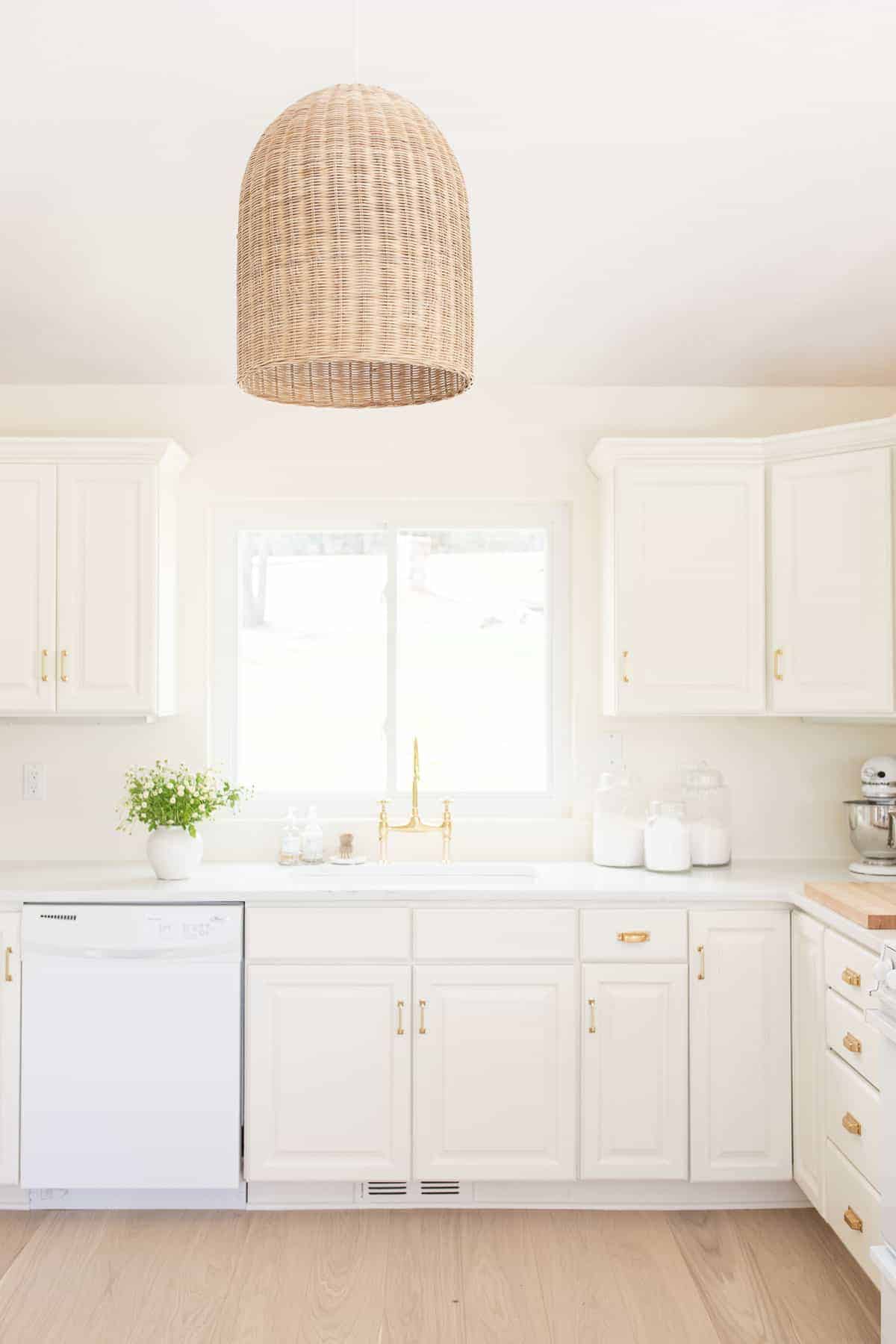 cream kitchen with rattan light
