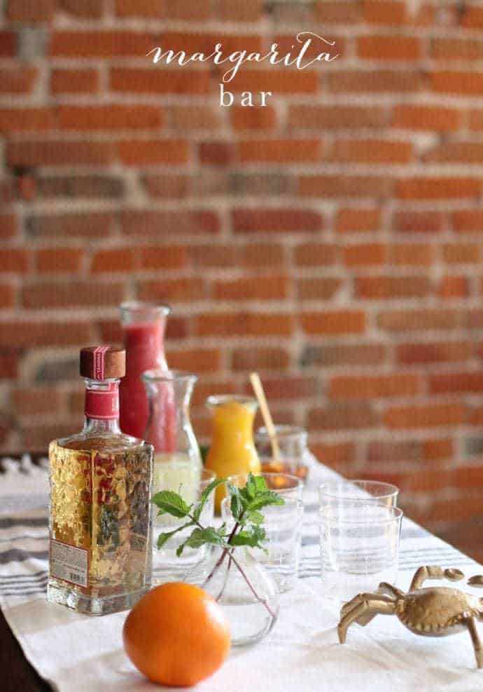 brick background with a margarita bar with the best tequila for margaritas.