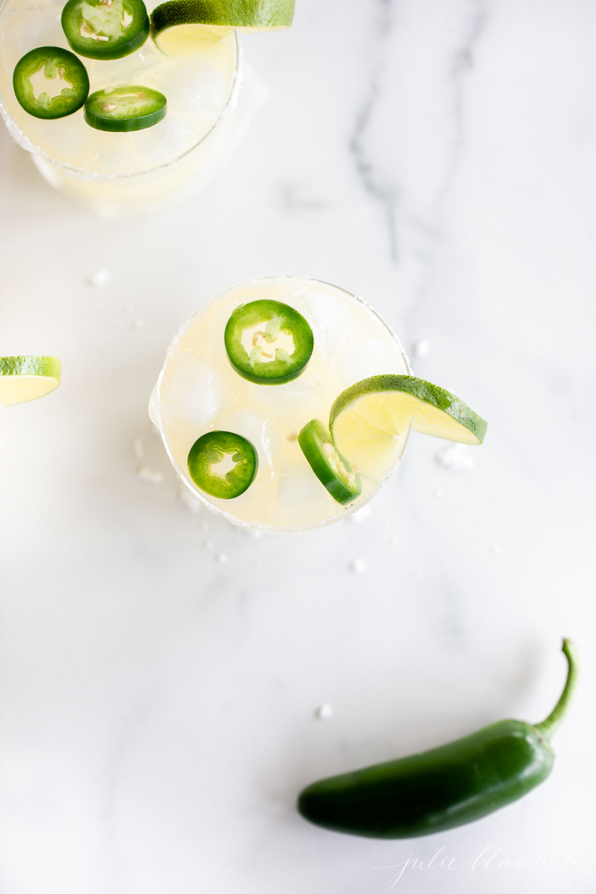 Jalapeno margarita with lime and jalapeno is a delicious twist on the classic Margarita. This spicy cocktail packs a punch with the heat of jalapenos, balanced out