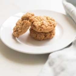 Flourless peanut butter cookies on a white plate.