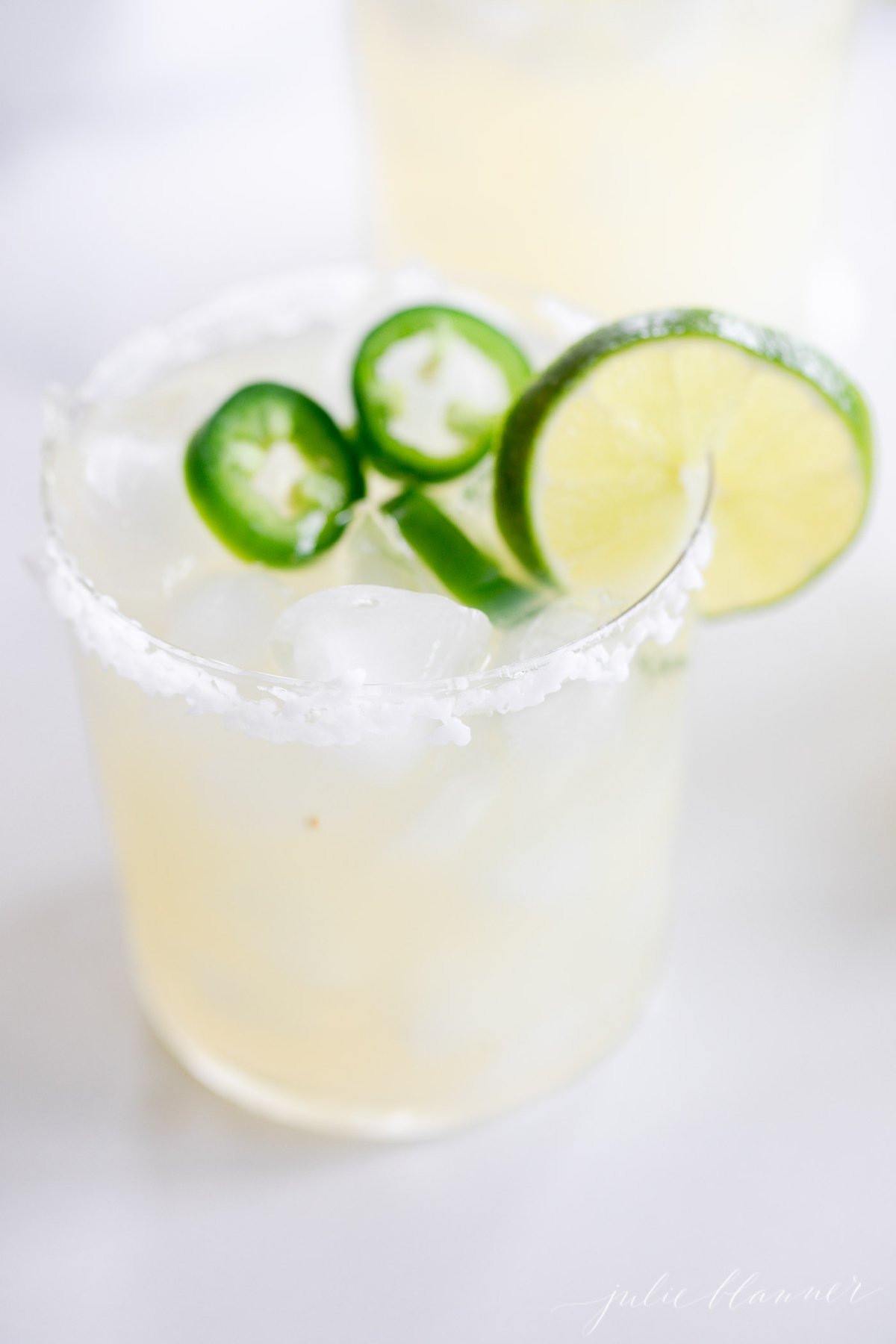 Spice up your margarita game with a fiery twist! This skinny spicy margarita recipe packs a punch with the zesty flavors of lime and jalapeno. Elevate your taste buds