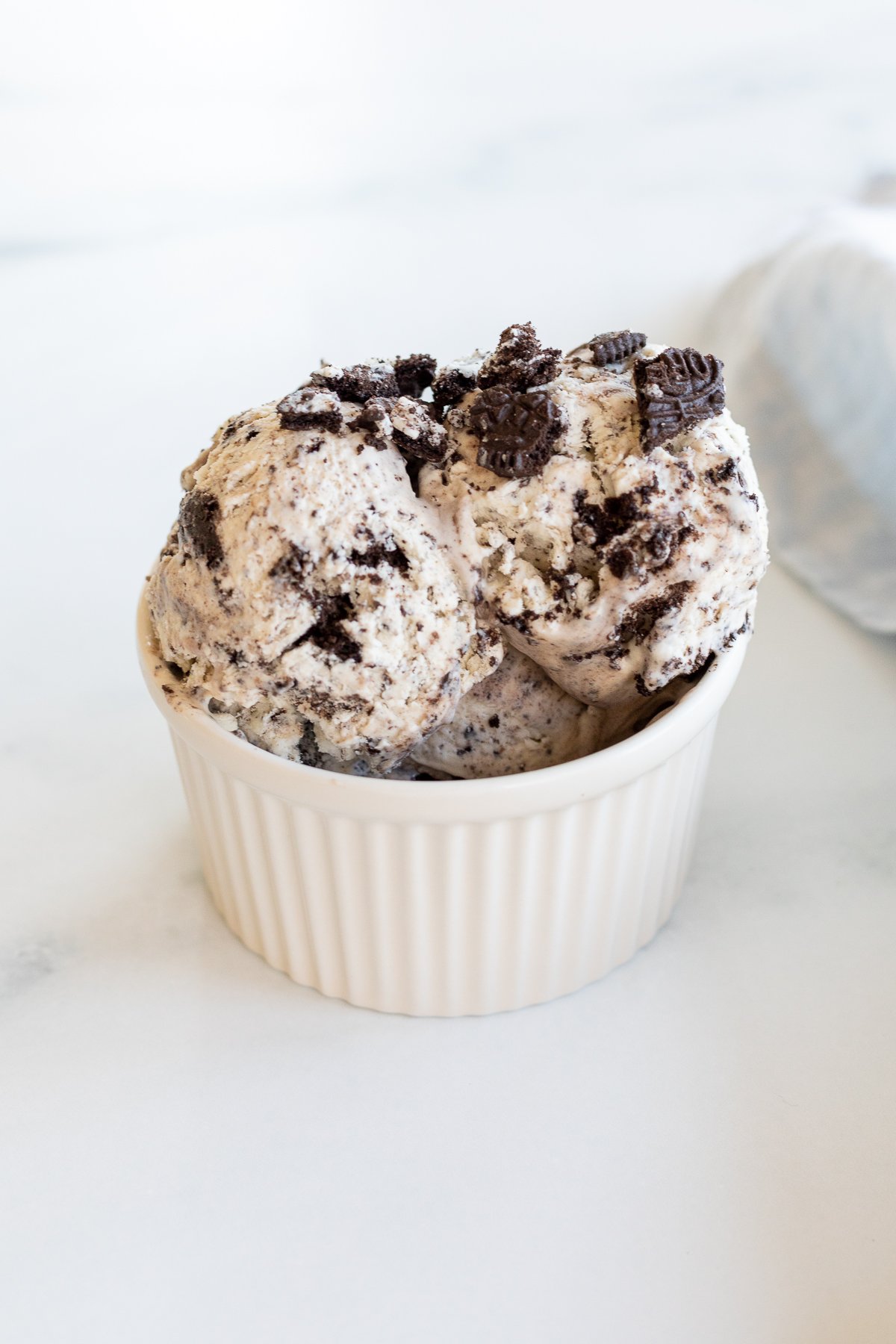 a white bowl of no churn cookies and cream condensed milk ice cream