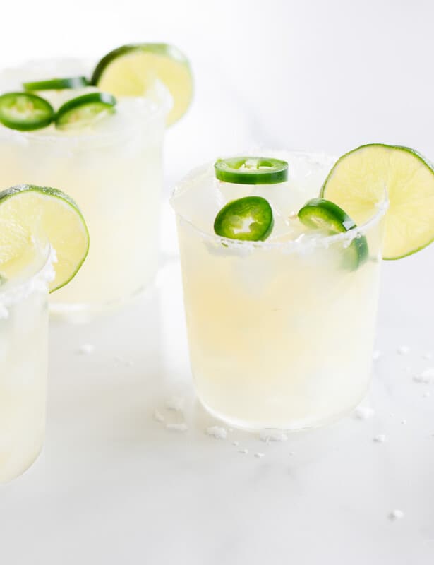 Marble surface, three glasses full of jalapeno margaritas.