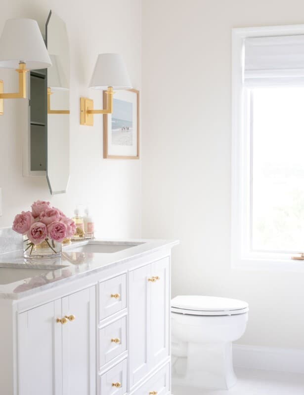 A pretty white bathroom with Benjamin Moore White Dove trim paint.