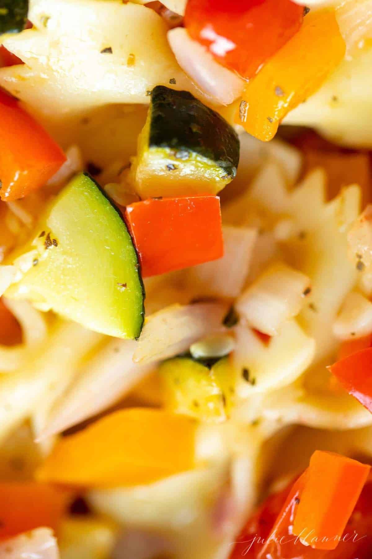 A close up shot of veggie pasta salad.