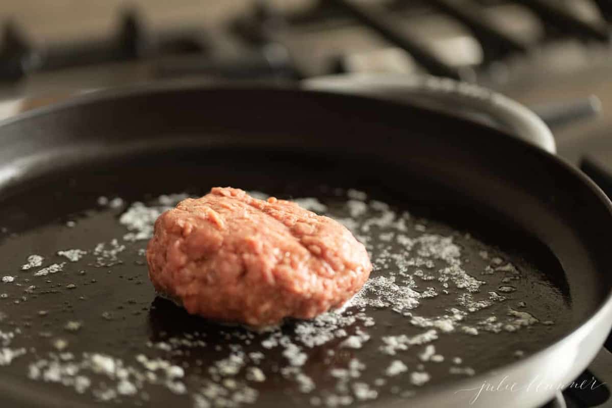 A stovetop burger in a cast iron pan.