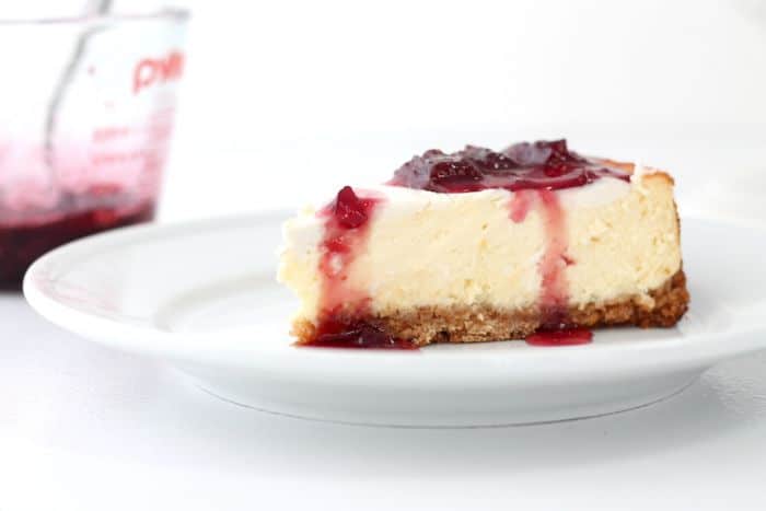 Strawberry cheesecake on a white plate.